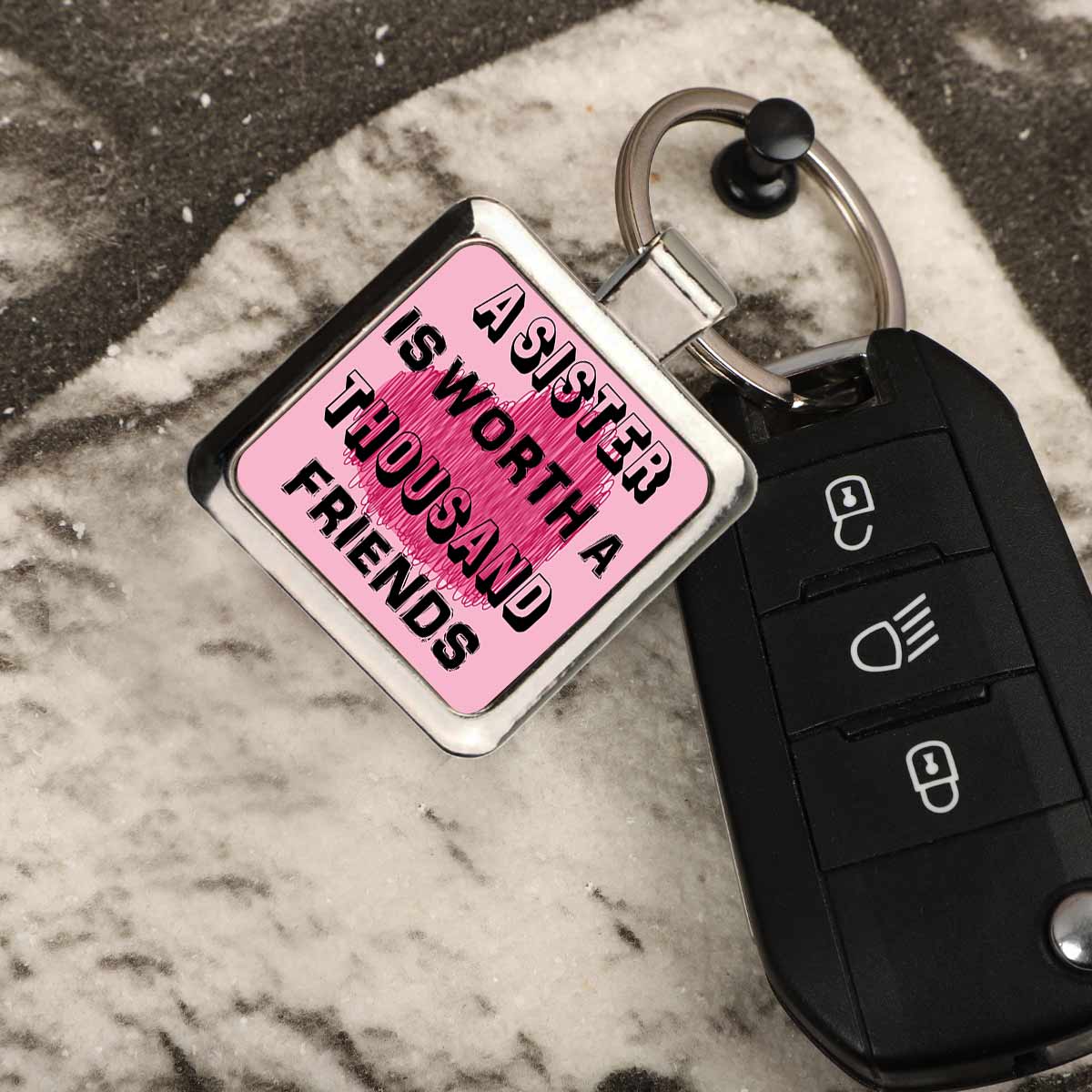 A Sister is worth Thousand Friends Metal Keychain