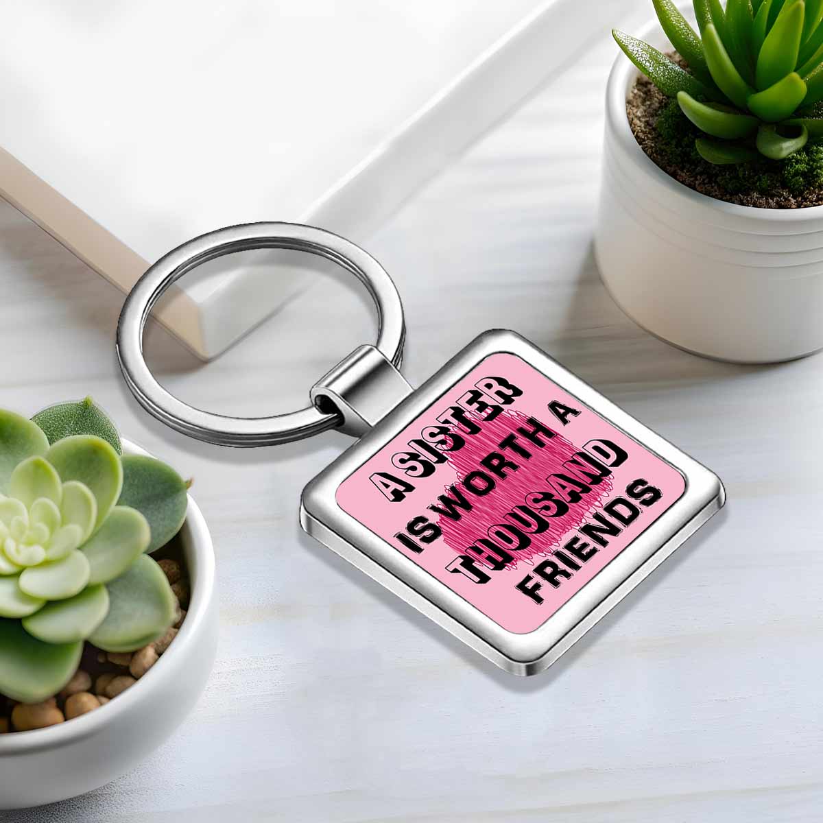 A Sister is worth Thousand Friends Metal Keychain