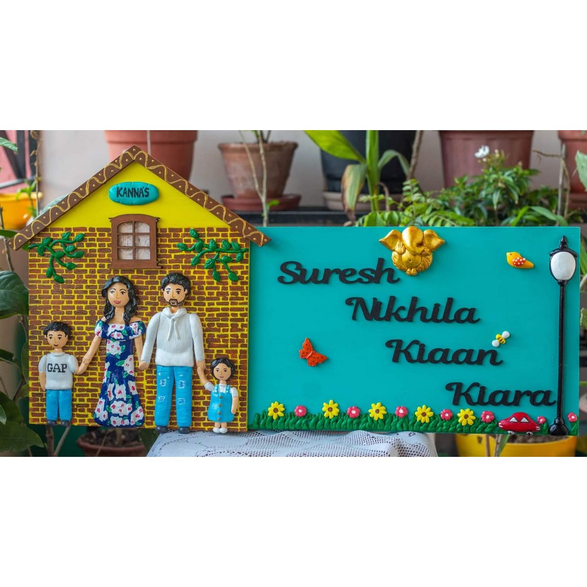 Handcrafted hut shaped family nameplate with Ganesha