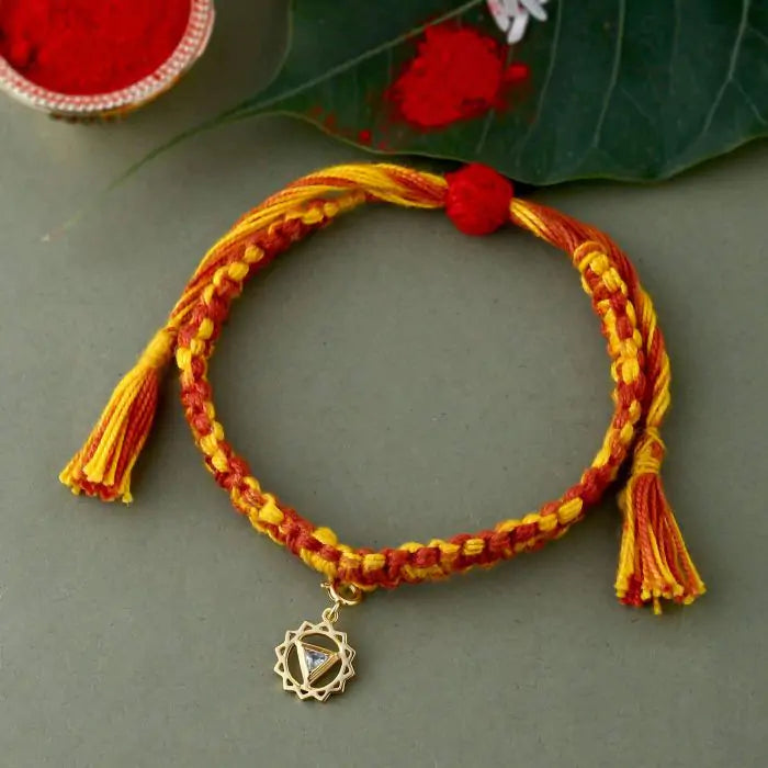 Vishuddha Chakra Rakhi With Gemstone - Gold